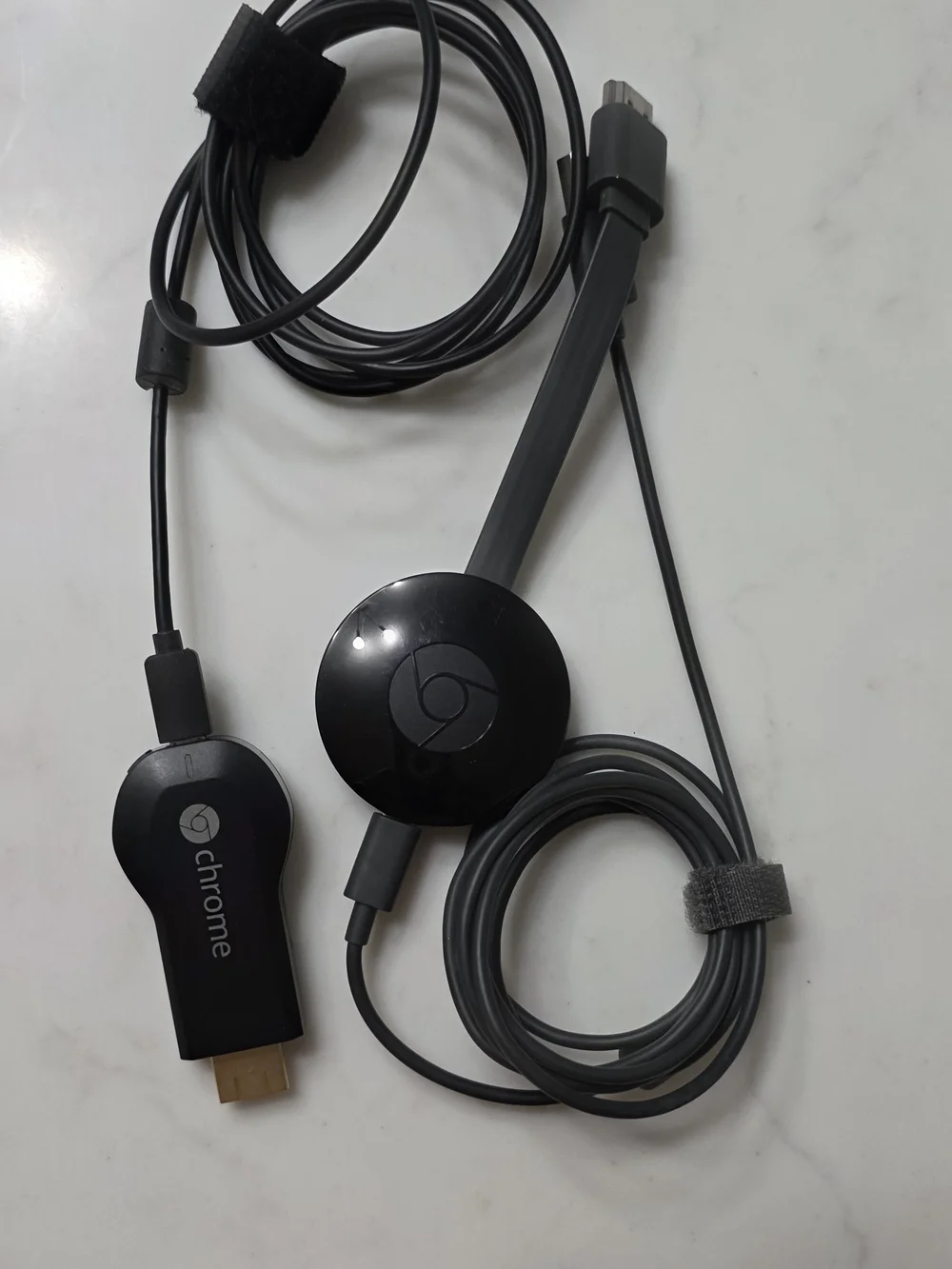 2 - Google Chromecast adapters and HDMI dongles in black